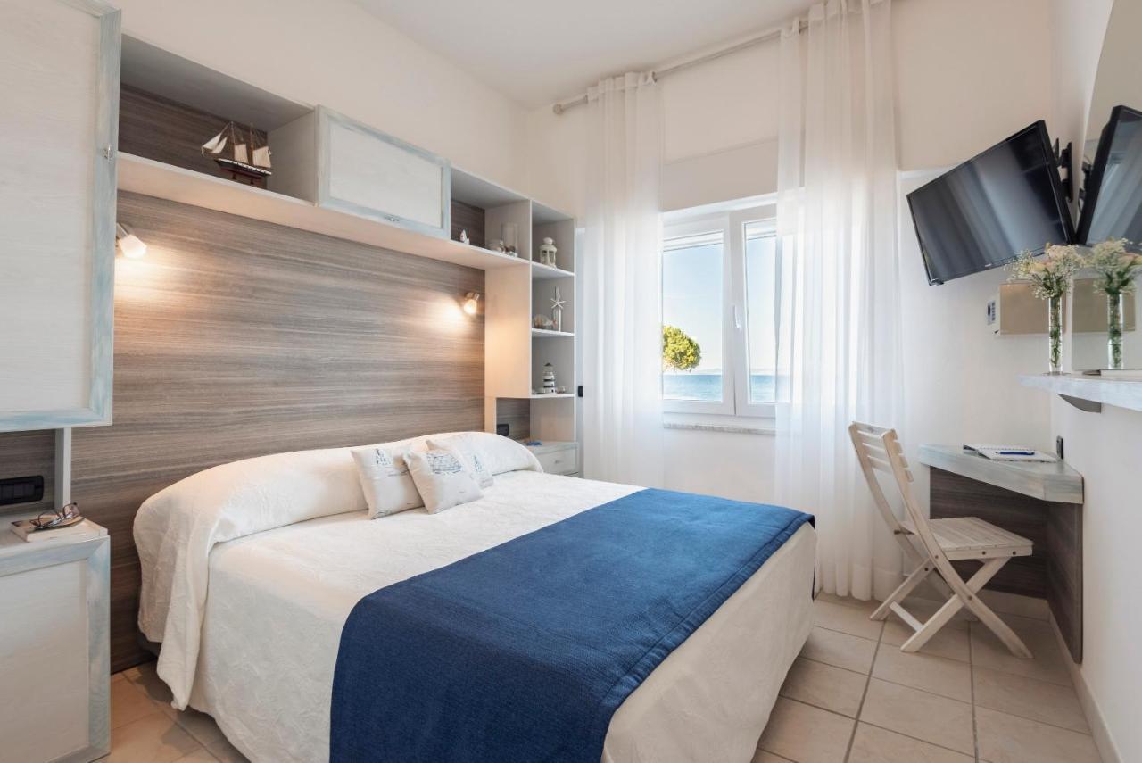 Hotel La Caletta Порто Санто Стефано Экстерьер фото