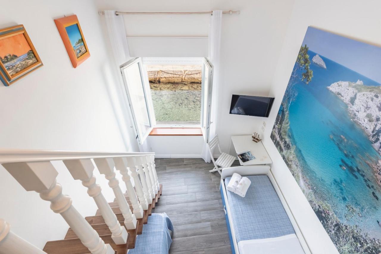 Hotel La Caletta Порто Санто Стефано Экстерьер фото