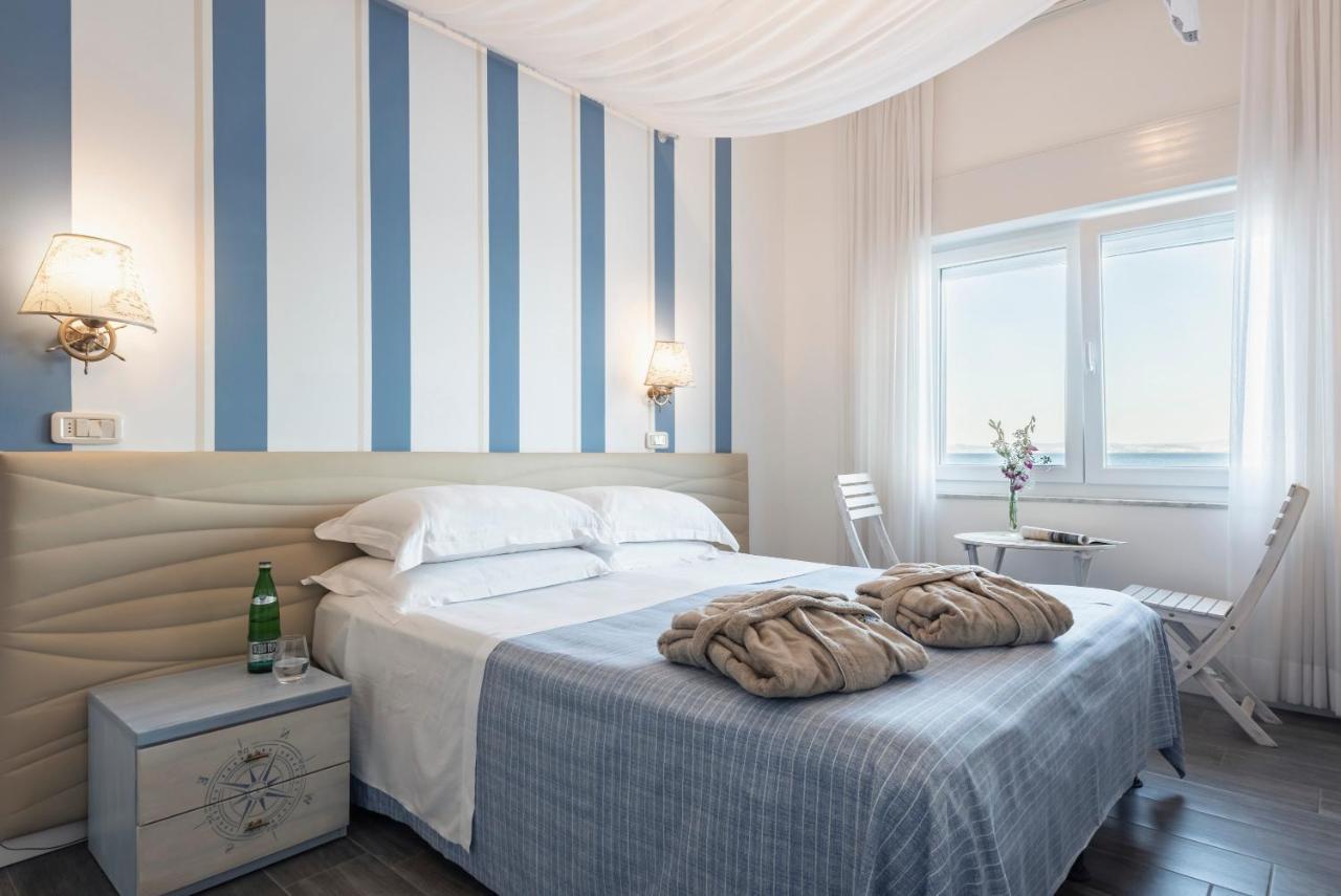 Hotel La Caletta Порто Санто Стефано Экстерьер фото