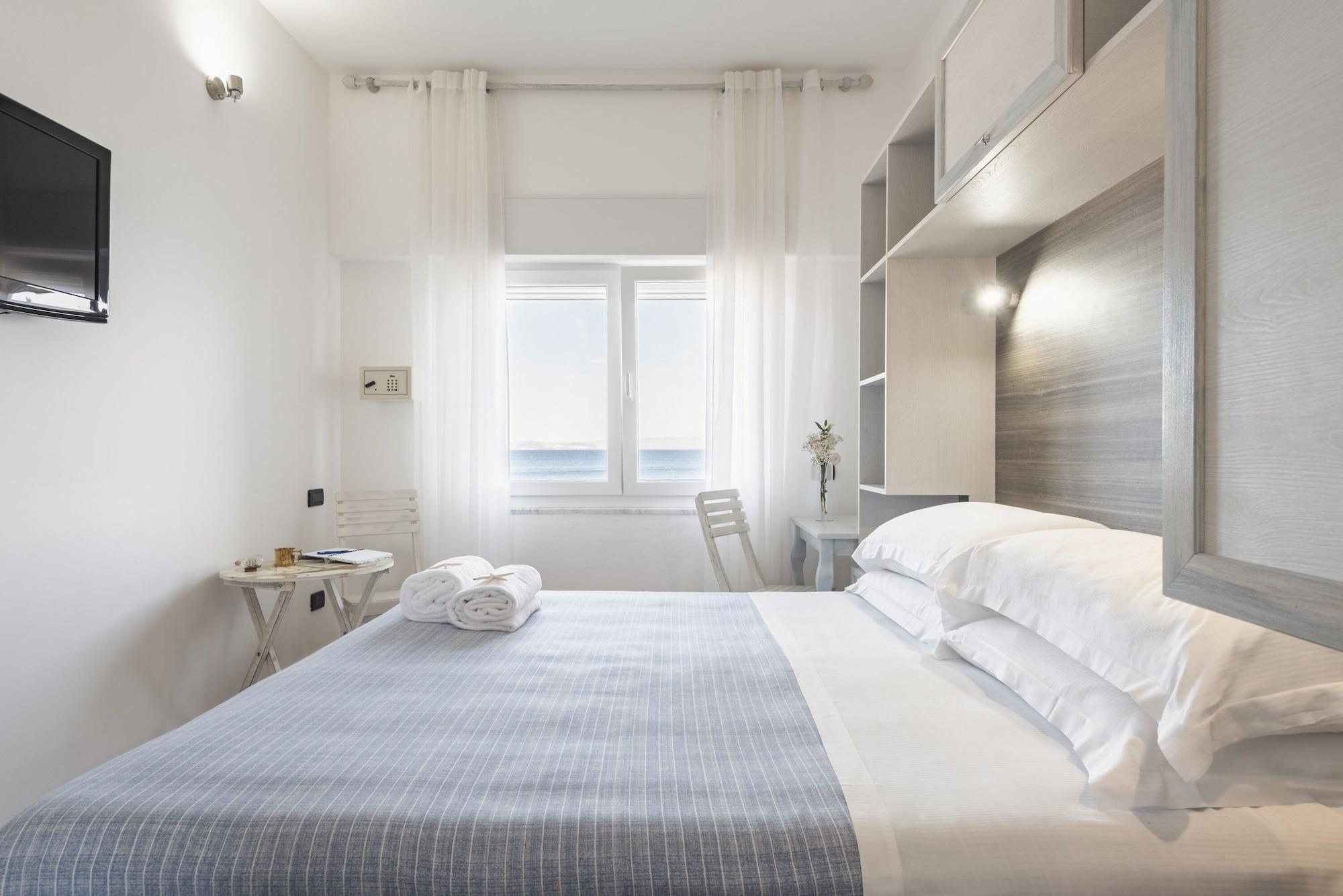 Hotel La Caletta Порто Санто Стефано Экстерьер фото
