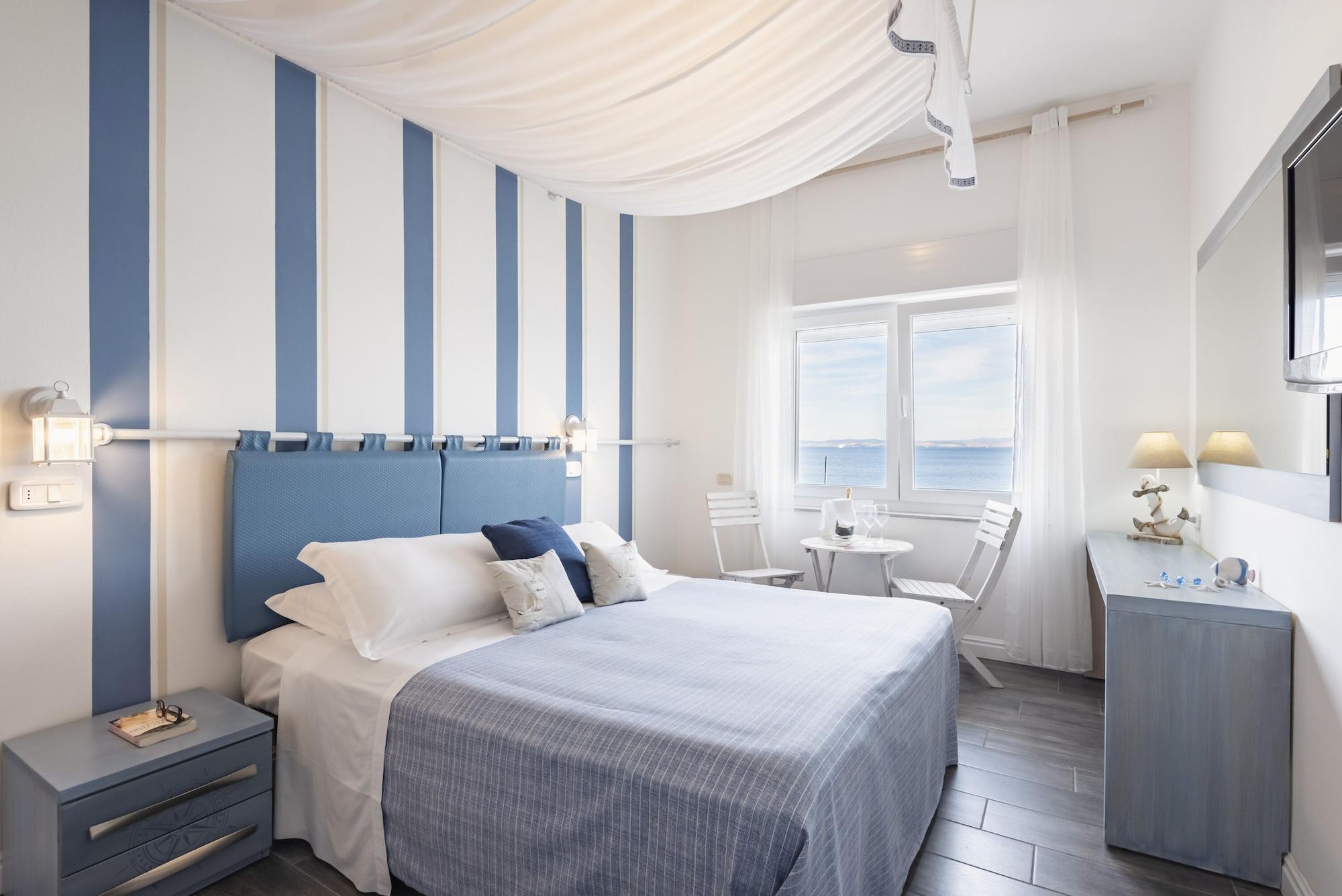 Hotel La Caletta Порто Санто Стефано Экстерьер фото