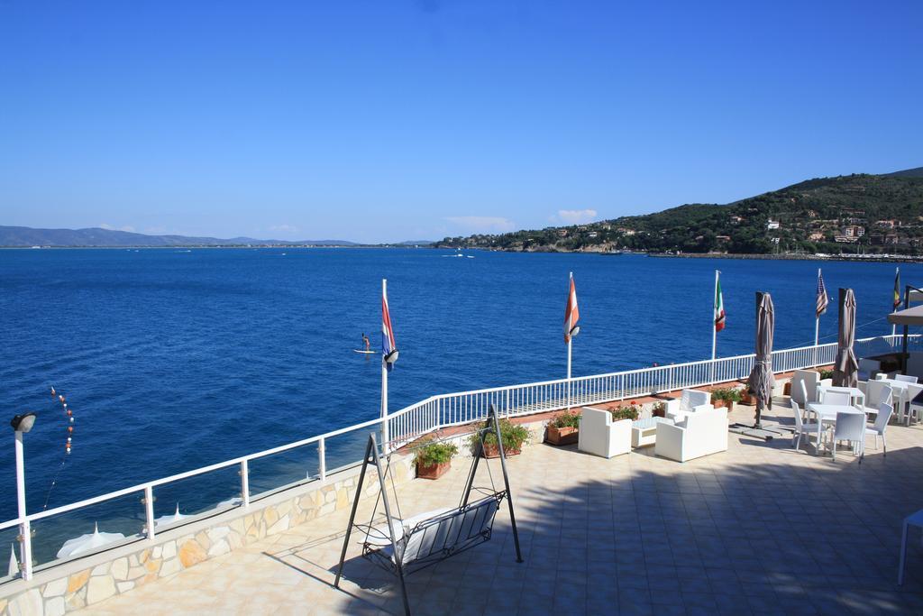 Hotel La Caletta Порто Санто Стефано Экстерьер фото